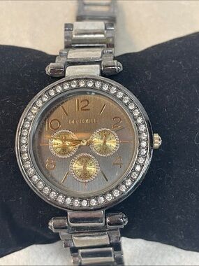 Ladies Deauville watch and silver and gun metal tones needs battery